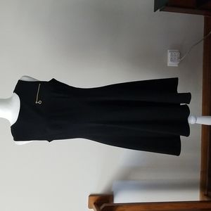 Calvin Klein A-line with gold zippers.